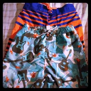 Two pairs of boys swim trunk board shorts